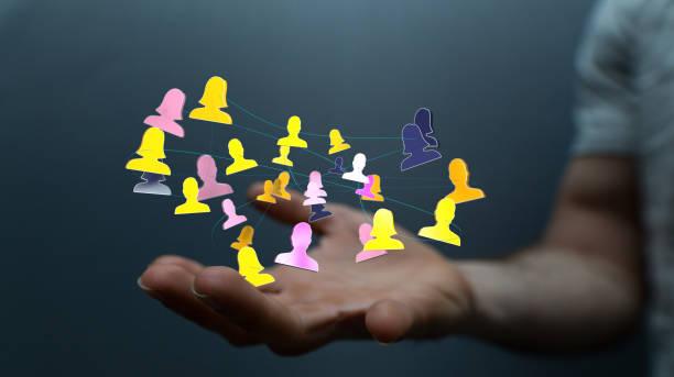 istock Hand touching 3D rendered icons of people - networking, remote work concept 1455677020