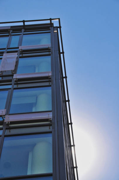 istock blue glass wall of office building mirror reflection 1455677358