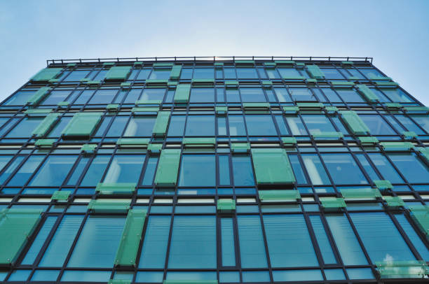 istock blue glass wall of office building mirror reflection 1455677408