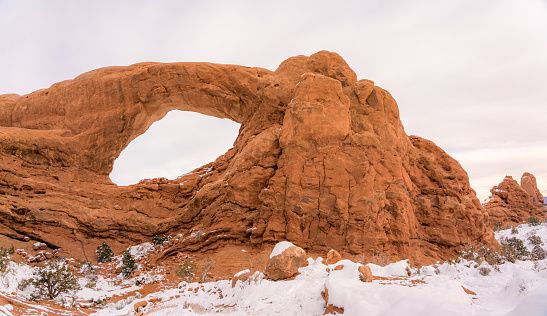 A beautiful shot of the Arches National Park covered in snow