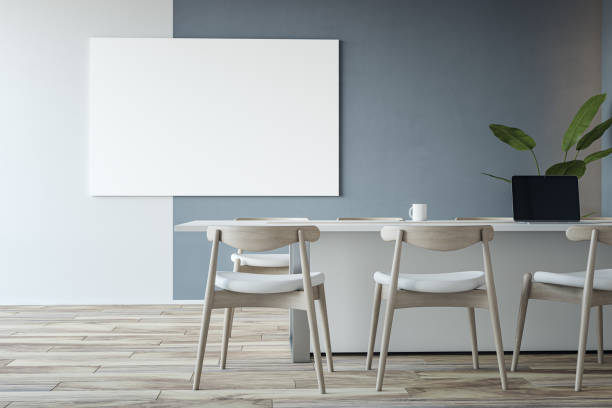 istock Front view on blank white poster with place for your logo or text on bicolor wall background in eco interior design meeting room with light furniture on wooden floor. 3D rendering, mock up 1455678751