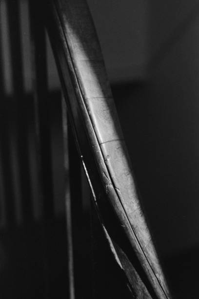 istock Grayscale of stairs railing in a building 1455679281