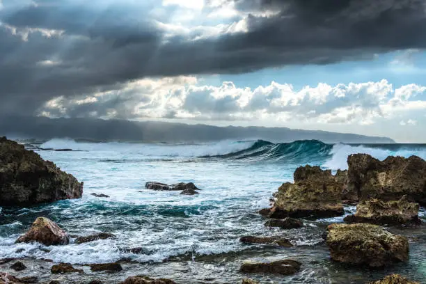 Photo of Stormy weather with high Hawaiian waves under the clouds