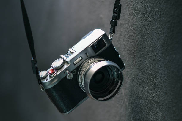 istock Closeup shot of a vintage camera on a grey background 1455680238
