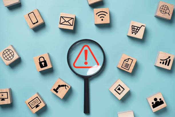 istock Magnifier glass with red triangle caution warning sign and technology icons  for notification error and maintenance support concept. 1455680572