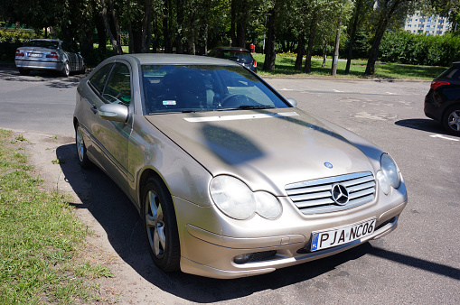 Poznan, Poland – July 11, 2015: A closeup of a parked luxury Mercedes Benz car in the Polan district