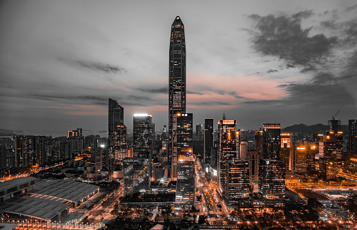 A modern cityscape with skyscrapers at dusk