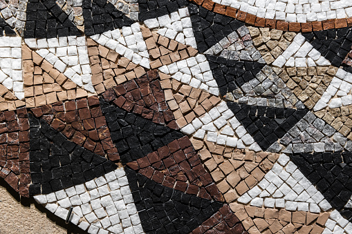 Stone mosaic, triangular pattern, close-up background photo texture