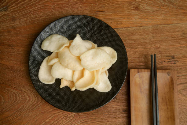Prawn crackers - a deep fried snack made from starch and prawn, common snack in Southeast Asian cuisine stock photo