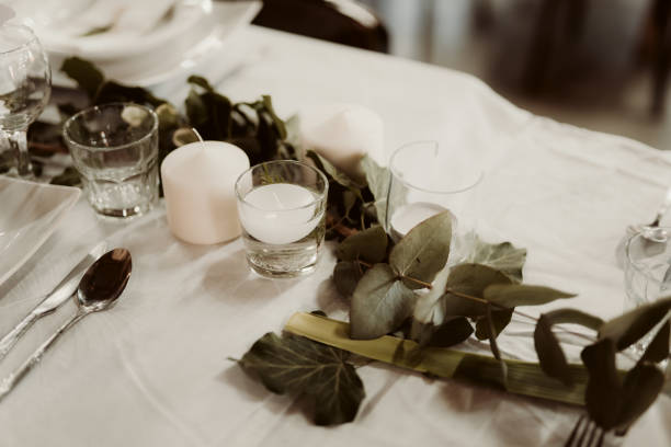 istock Beautifully decorated table with candles and leaves 1455687124