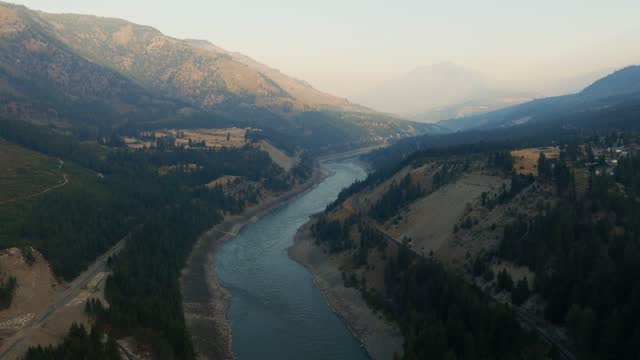 The Fraser River at sunrise in BC. A huge flowing river system in Western Canada supporting wild Salmon, near Lytton British Columbia.
