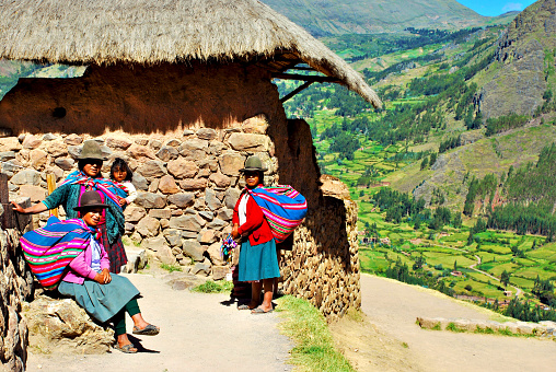 Cusco, Peru – July 17, 2020: Portrait of local people dressing in traditional clothing in Pisac near Cusco, Peru