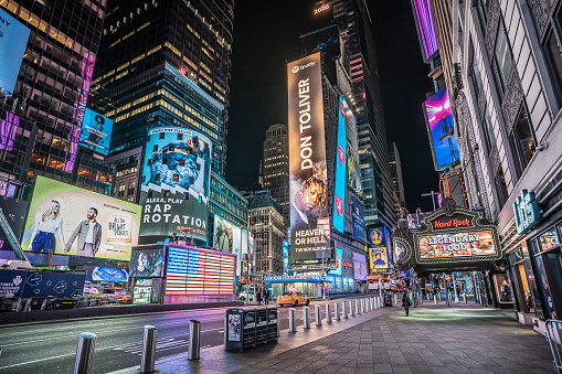 New York City, United States – March 19, 2020: The colorful NYC with lights and advertisements during the Coronavirus Pandemic in the US