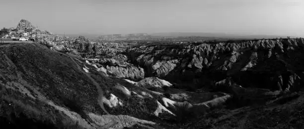 Photo of Grayscale shot of the mountains and hills of Cappadocia
