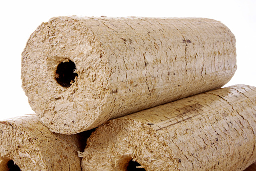 The round wooden briquettes isolated on a white background