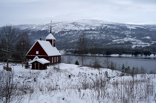Noresund, Norway – December 11, 2021: The Veikaker wooden church by the lake Kroderen, Norway