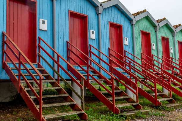 istock Row of cabins with red stairs 1455693351