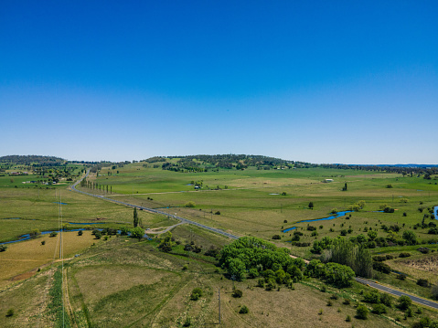 A beautiful view of the town of Glen Innes with fields and large trees