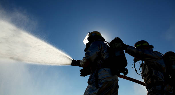 istock Firefighters trying to put out a fire 1455695025