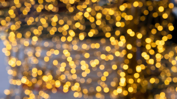 istock Blurred gold bokeh light background for wallpapers 1455695109