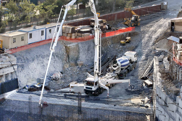 istock Construction site with concrete mixer truck and crane 1455695979
