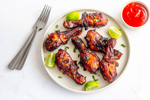 istock Grilled BBQ Chicken on a Plate Top Down Chicken Appetizer Photo 1455696830