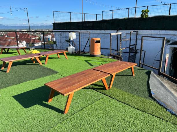 istock Sunny terrace of restaurant featuring table and chair 1455697656