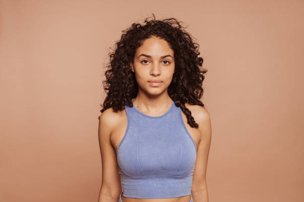 istock Beautiful multiracial sportswoman posing at studio 1455697744