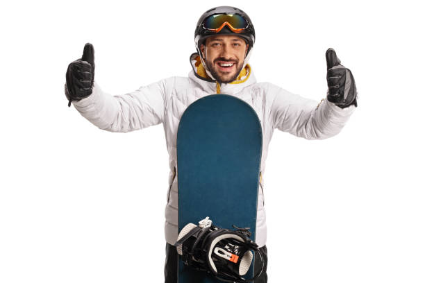 Young man with a snowboard gesturing with both thumbs up Young man with a snowboard gesturing with both thumbs up isolated on white background thumbs up for skiing stock pictures, royalty-free photos & images