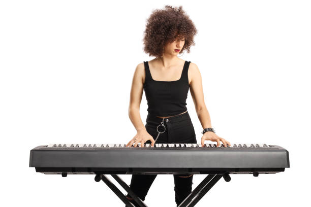 istock Young female musician playing a digital piano 1455699774