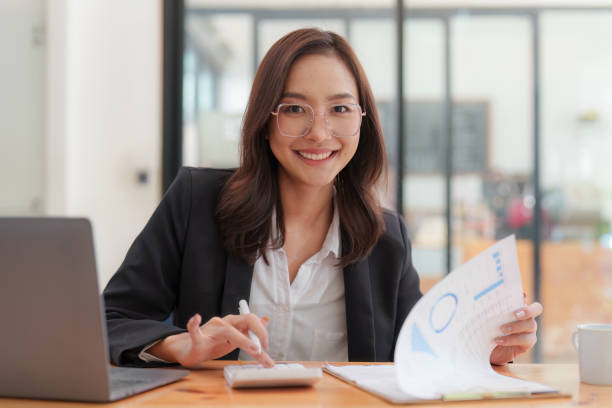 istock Administrator business people financial inspector making report calculating balance. Internal Revenue and Accounting concept 1455700512