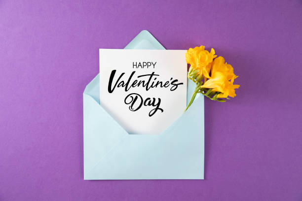 istock Yellow Flowers with White Greeting Card in Purple Envelope 1455704391