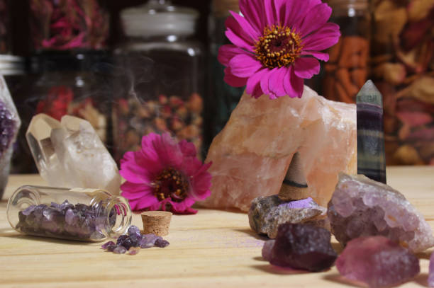 istock Amethyst Crystals With Flowers and Incense Cone on Meditation Table 1455704738