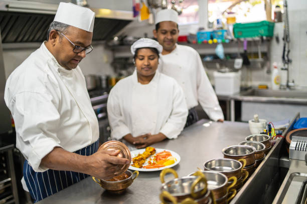 istock A head chef is checking the curries and appetizer before sending them to the restaurant 1455705364