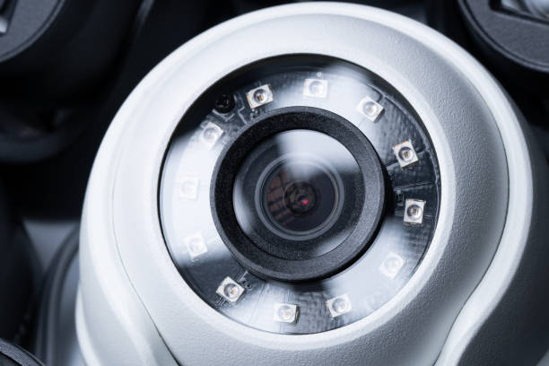 istock Close-up white security camera with black cameras nearby. 1455706304