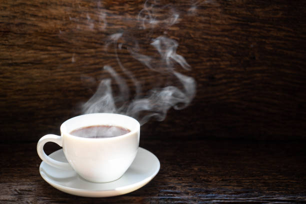 istock hot coffee and smoke on wood background 1455708002