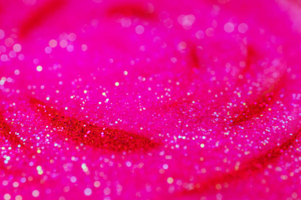 istock Abstract  red and pink glitter sparkle background 1455708266