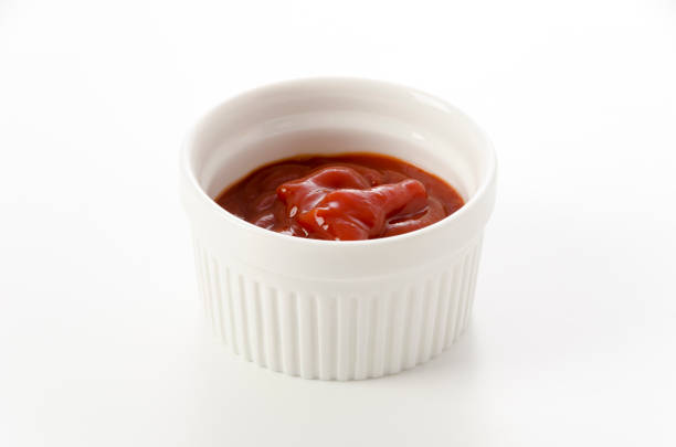 istock tomato ketchup in a small cocotte on a white background 1455708554