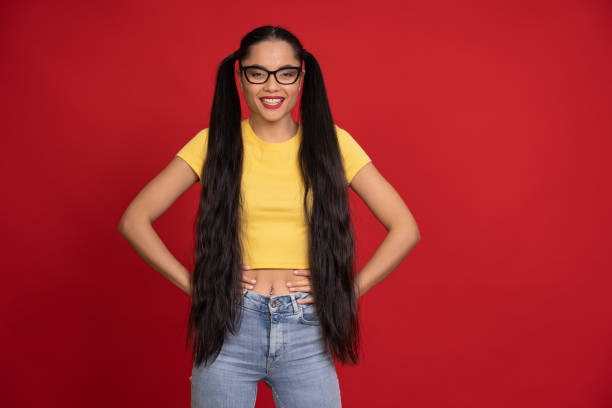 istock Asian women standing in front of red background 1455709997