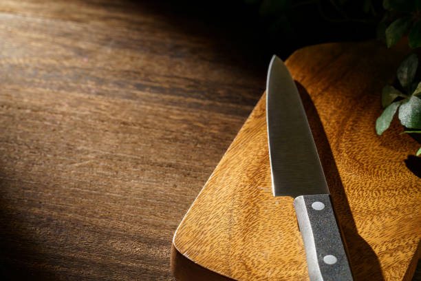 istock Kitchen knife and cutting board on wooden table 1455711969