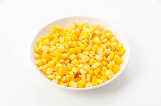 istock Canned sweet corn on a white plate on white background 1455712083
