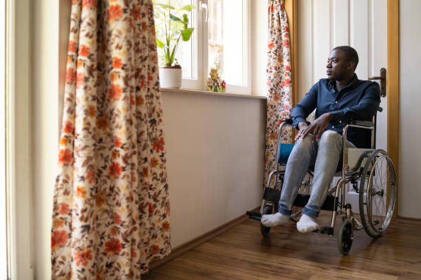 istock A disabled man takes a break from his laptop 1455712244