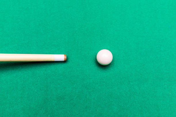 istock Billiard pool game one white ball with cue on billiard table with green cloth.Copy space. 1455713033
