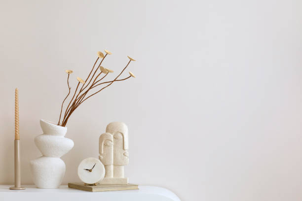 istock Minimalist composition of elegant and outstanding space with copy space, vase with dried flowers and personal accessories. Home decor. Template. 1455713530