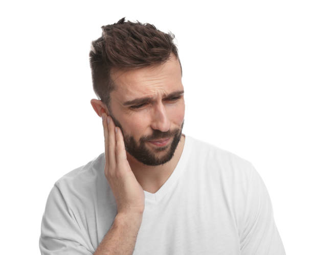 istock Man suffering from ear pain on white background 1455714089