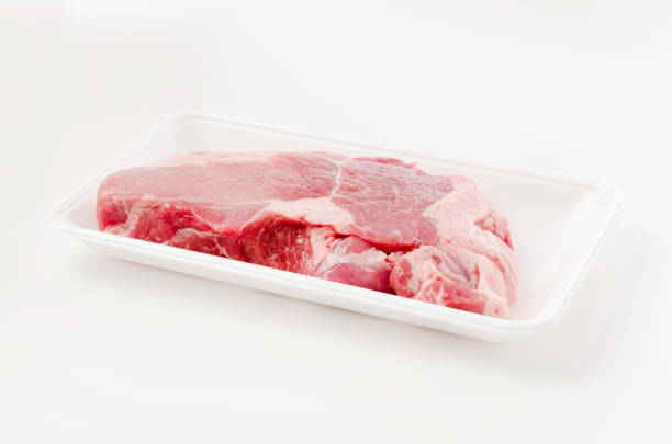istock Raw Pork meat on foam tray on white background 1455715989