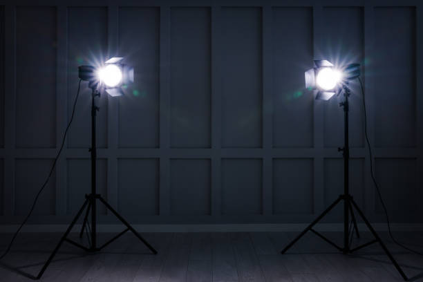 istock Bright white spotlights near wall indoors, space for text 1455716039