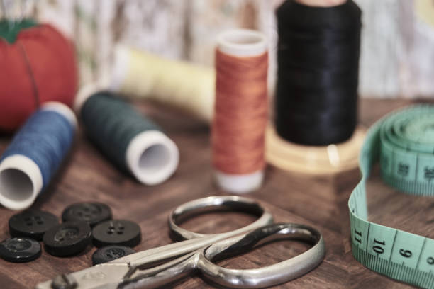 istock Threads and accessories for sewing on a wooden background. 1455716084