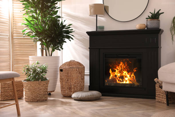 istock Stylish room interior with electric fireplace and beautiful decor elements 1455716426