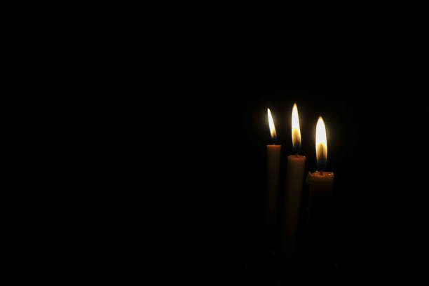 istock Candles burning in the dark 1455718176